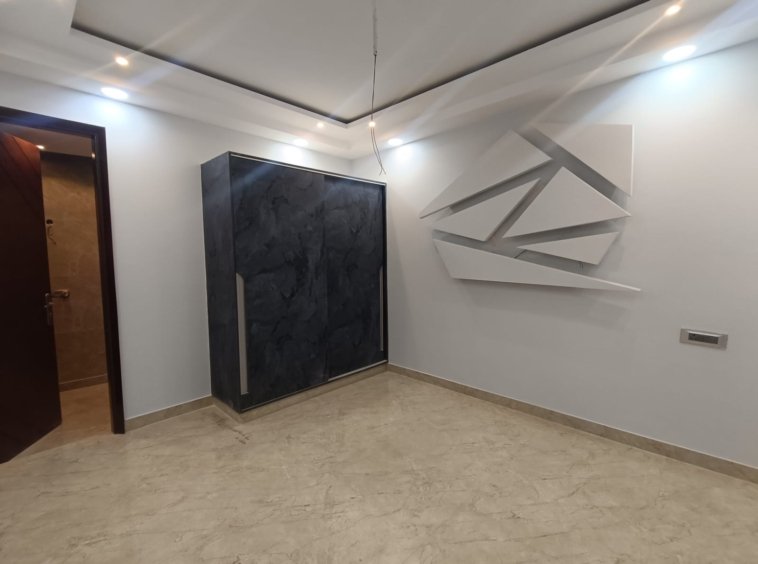 Front view of a newly renovated 3 BHK DDA MIG Flat on the first floor in B3B Block Janakpuri, featuring dual balconies, modern design, and corner location.