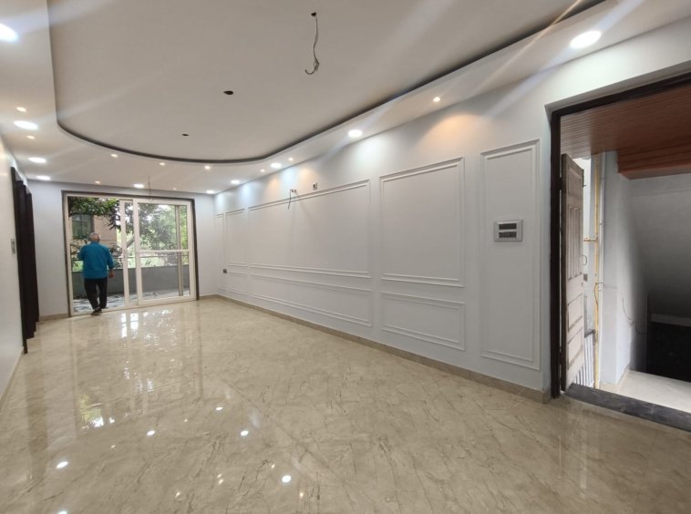 Front view of a newly renovated 3 BHK DDA MIG Flat on the first floor in B3B Block Janakpuri, featuring dual balconies, modern design, and corner location.