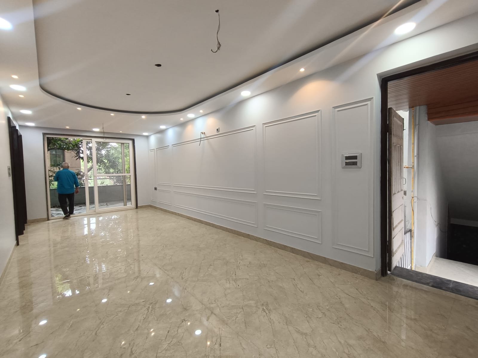 Front view of a newly renovated 3 BHK DDA MIG Flat on the first floor in B3B Block Janakpuri, featuring dual balconies, modern design, and corner location.
