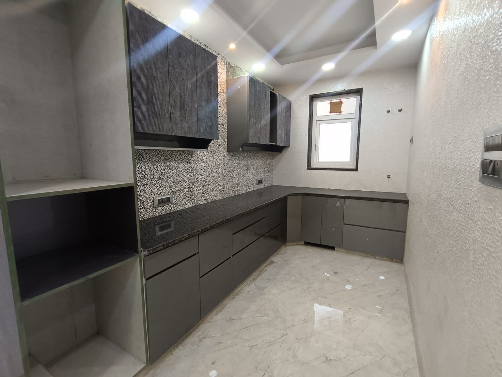 Front view of a newly renovated 3 BHK DDA MIG Flat on the first floor in B3B Block Janakpuri, featuring dual balconies, modern design, and corner location.