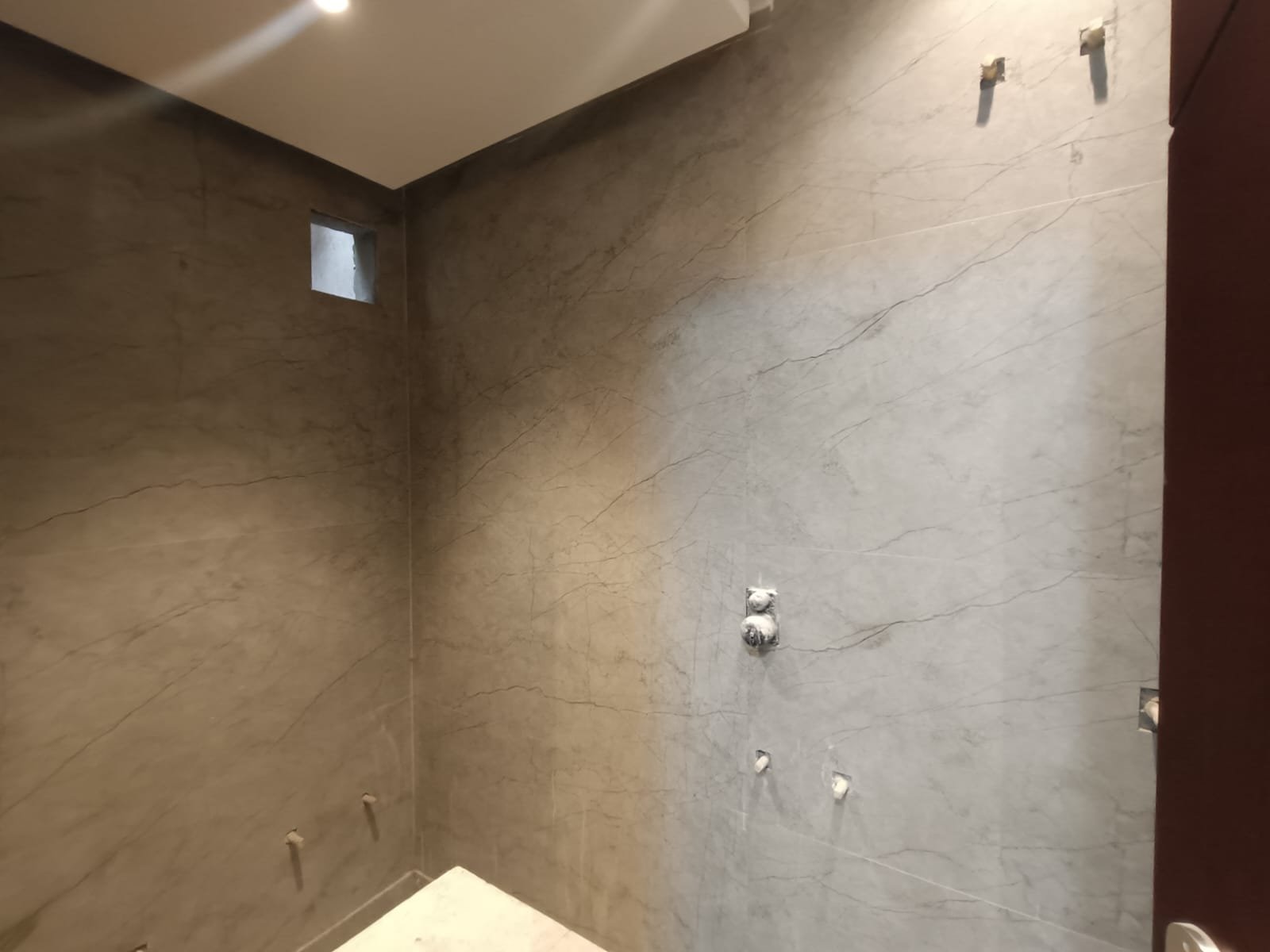 Front view of a newly renovated 3 BHK DDA MIG Flat on the first floor in B3B Block Janakpuri, featuring dual balconies, modern design, and corner location.