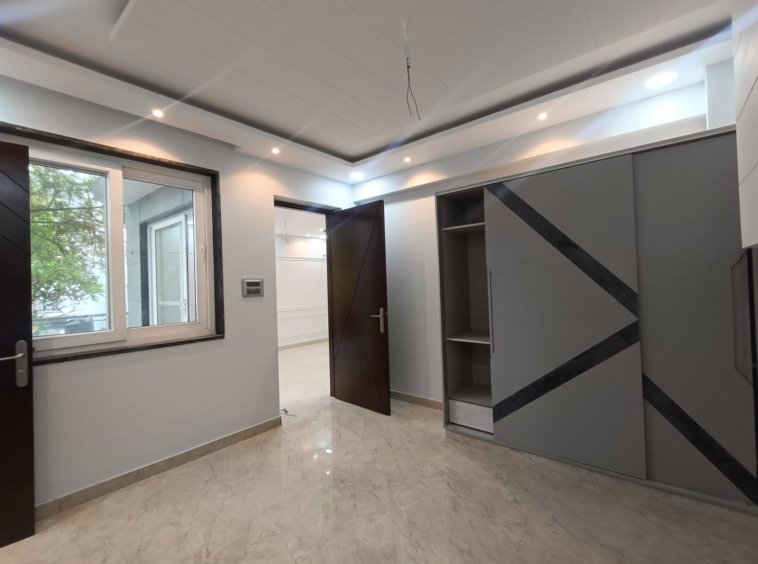 Front view of a newly renovated 3 BHK DDA MIG Flat on the first floor in B3B Block Janakpuri, featuring dual balconies, modern design, and corner location.