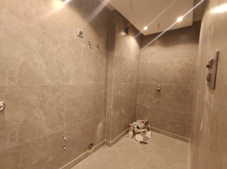 Front view of a newly renovated 3 BHK DDA MIG Flat on the first floor in B3B Block Janakpuri, featuring dual balconies, modern design, and corner location.