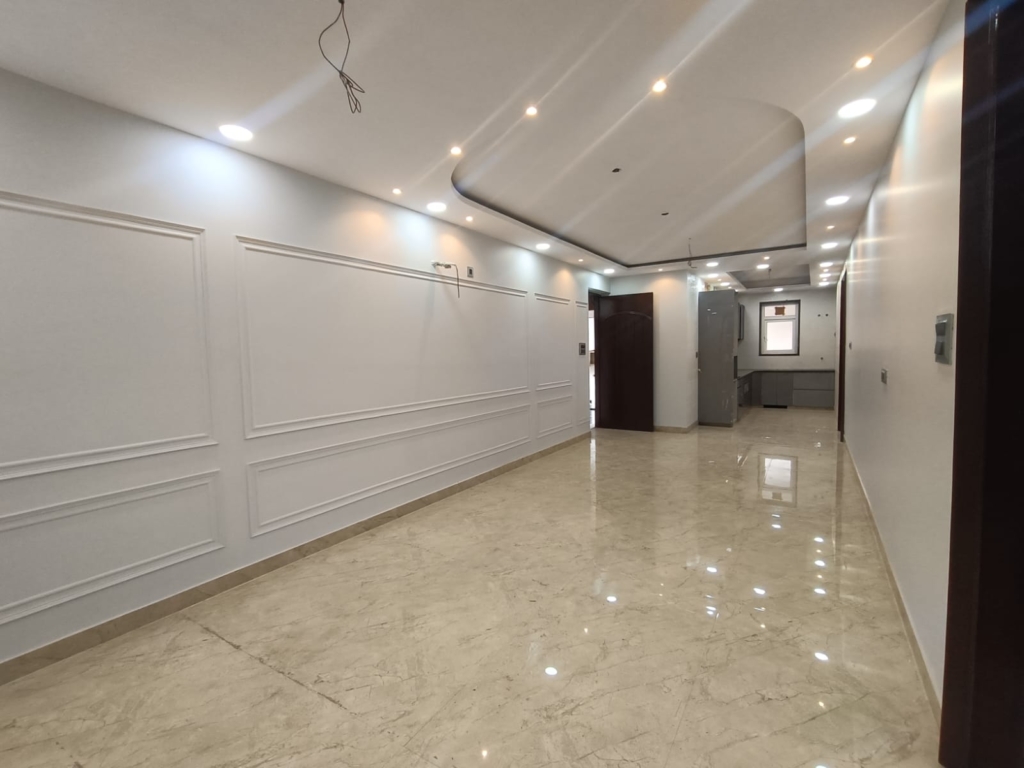 Front view of a newly renovated 3 BHK DDA MIG Flat on the first floor in B3B Block Janakpuri, featuring dual balconies, modern design, and corner location.