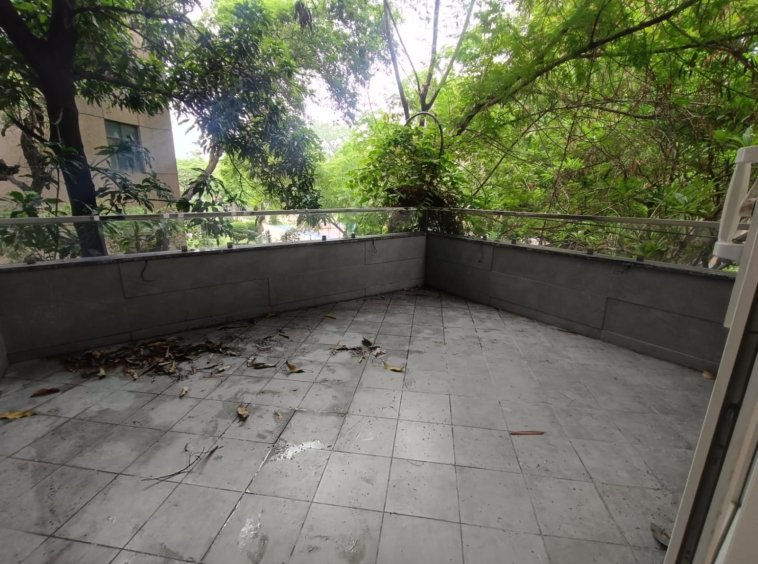 Front view of a newly renovated 3 BHK DDA MIG Flat on the first floor in B3B Block Janakpuri, featuring dual balconies, modern design, and corner location.