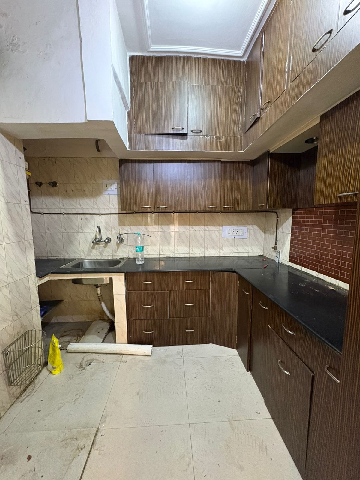 Spacious 2 BHK first-floor for rent in C6B Block Janakpuri featuring a modular kitchen and wide balcony. Rent ₹25,000. Ideal for comfortable family living.
