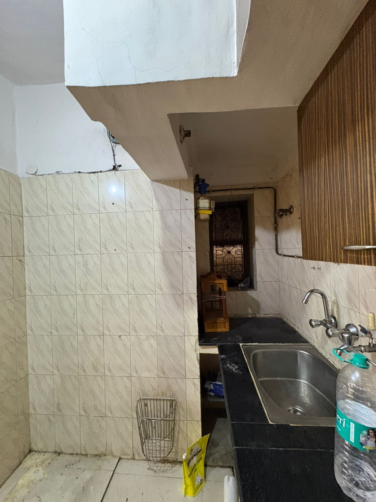 Spacious 2 BHK first-floor for rent in C6B Block Janakpuri featuring a modular kitchen and wide balcony. Rent ₹25,000. Ideal for comfortable family living.