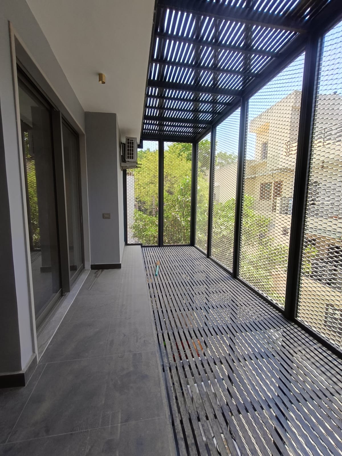 Rear balcony with bird mesh protection and ventilation Janakpuri home