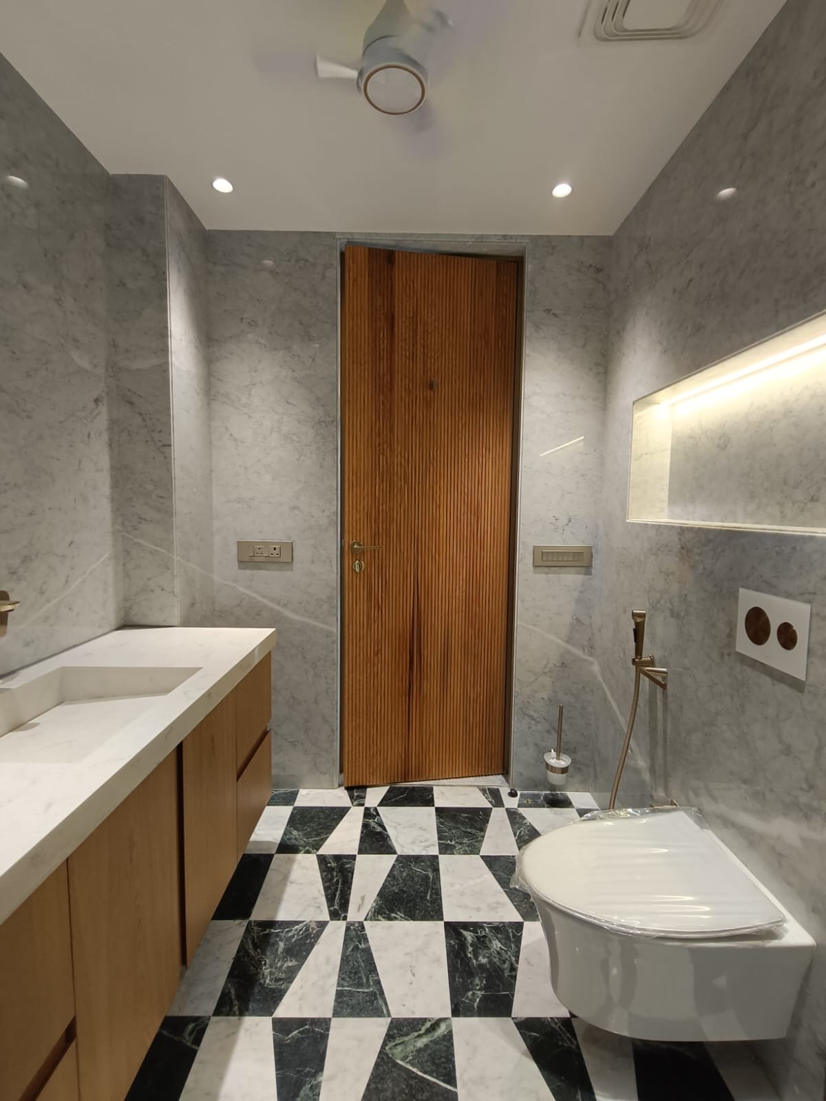 Premium Kohler bathroom with modern fittings luxury builder floor Janakpuri