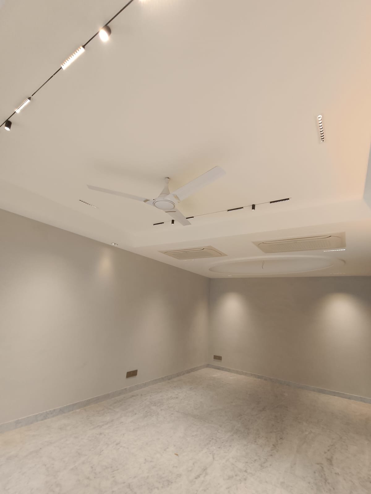 Spacious 4 BHK living room with Italian marble flooring Janakpuri