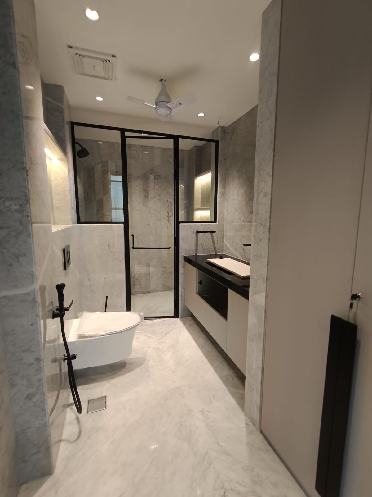 Premium Kohler bathroom with modern fittings luxury builder floor Janakpuri